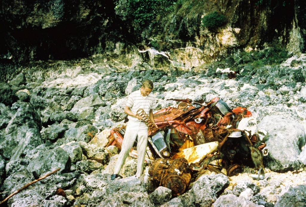 Dean Paulsen next to wrecked car.