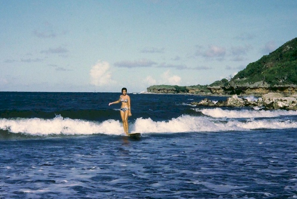 Surfer girl at Talofofo Bay