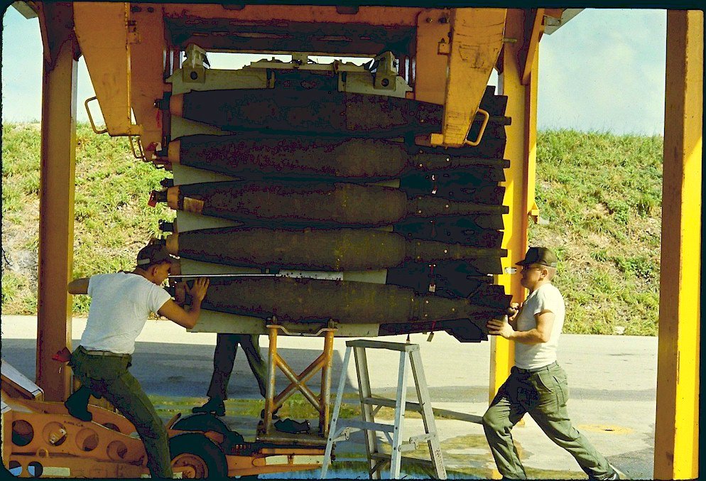 Muscling a 500 lb bomb into place